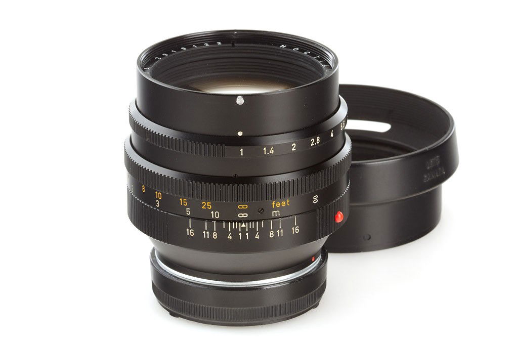 Noctilux 1/50mm 11821: early Noctilux, first version with E58 filter size, in mint condition, clean lenses, rear cap, hood 12519, Hoya UV filter