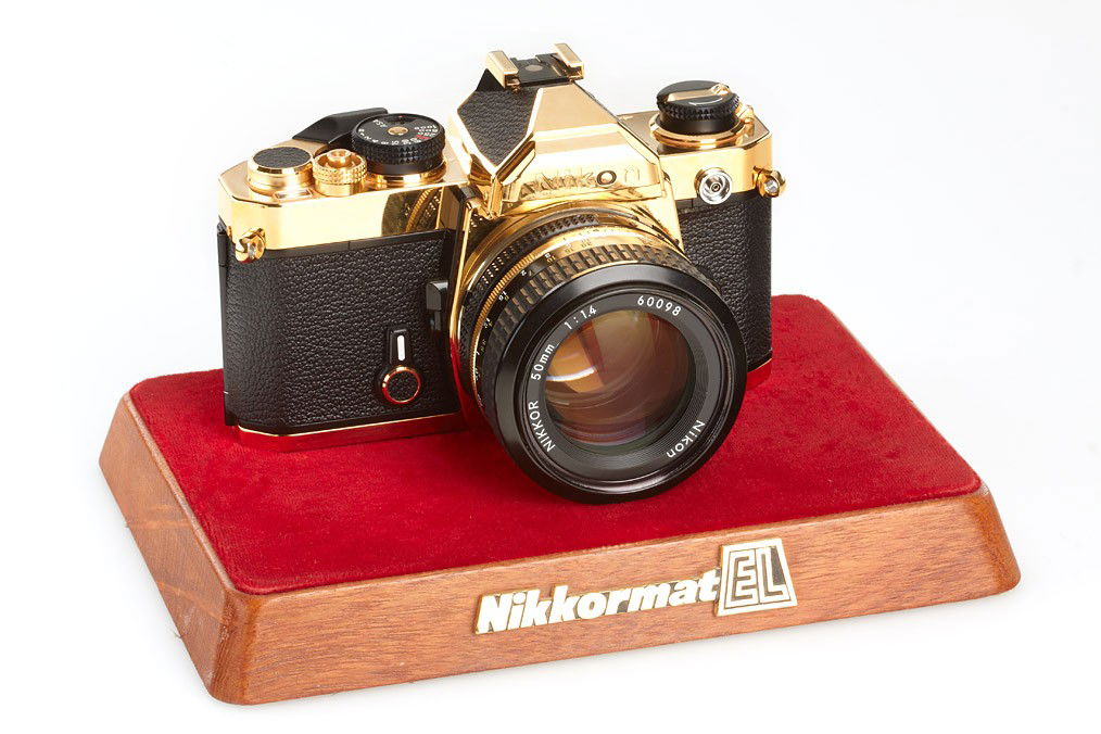 Nikon FM Gold: the gold plated Nikon FM was not sold to the public - only approx. 300 cameras were made for the 60th anniversary of Nikon company, with matching AI Nikkor 1.4/50mm with special number 60098, cap, Nik