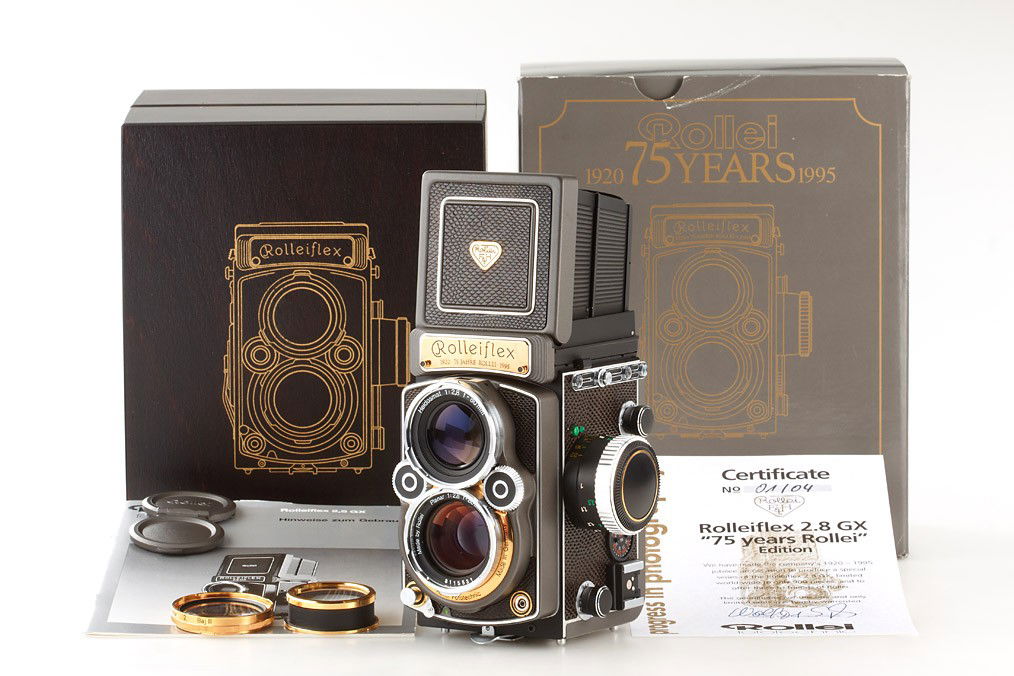 Rolleiflex 2.8GX '75 Years': new edition for Rollei's 75th anniversary, gold plated metal parts, reptile-look leather, Planar 2.8/80mm no.8115531, cap, strap, gold plated Rolleinar set, certificate, guarantee, instructions, woode