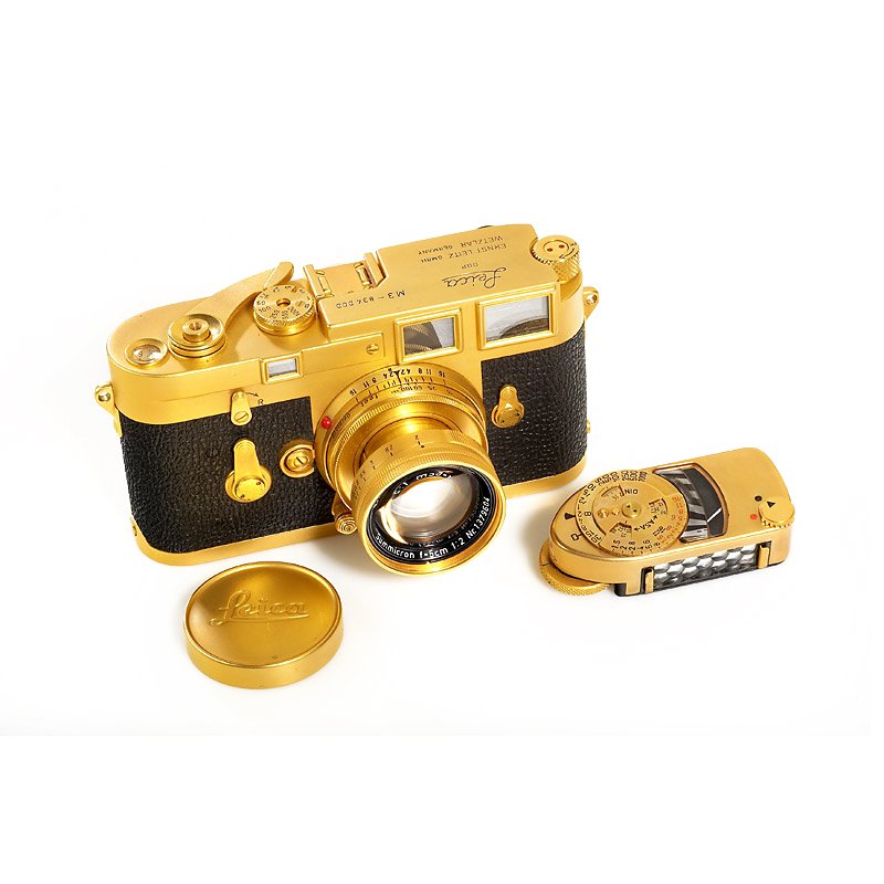 M3 Gold, SN: 834000, 1956: One of only two known M3 cameras originally gold plated by Leitz with gold plated collapsible Summicron 2/5cm no.1379604, gold plated cap, gold plated Leica Meter MC no.51310. According to delivery re