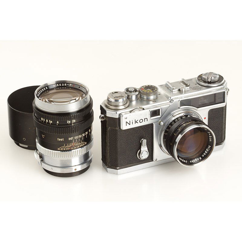 Nikon SP Chrome Set, SN: 6206749, c.1958: heavy used SP with good working shutter, Nikkor-S 1.4/5cm no.411403 (marks on rear element, locking pin cut off), Nikkor-P.C 2.5/10.5cm no.812923 (cond. B, hood, rear cap) - ex Tad Sato collection