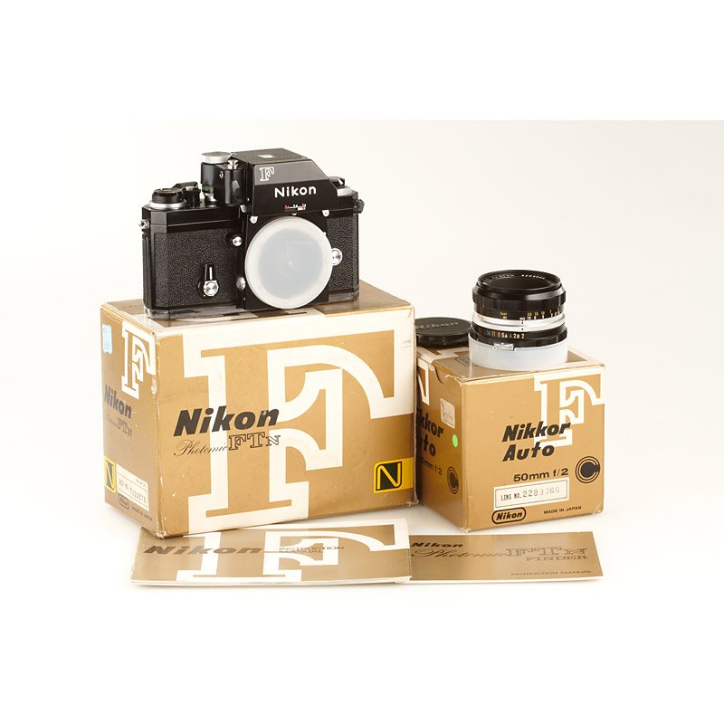 Nikon F Photomic FTN Black, SN: 7424576, c.1973: rare boxed Apollo outfit in new condition with cap and papers in maker's box, matching Nikkor-H 2/5cm no.2289066 with caps in maker's box