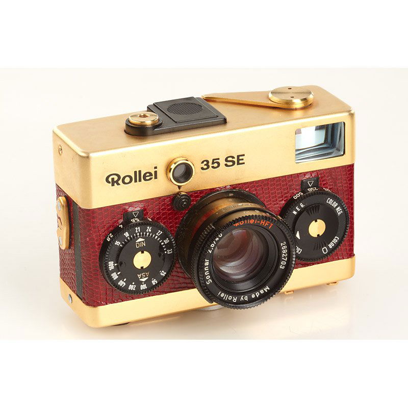 Rollei 35 SE Gold, SN: 2692703, c.1980: unique Rollei 35 SE with gold plated top and base plate, red reptile-leather covering, Sonnar 2.8/40mm, made by Rollei Singapore, cap, case, strap - probably delivered to a dealer as a gift