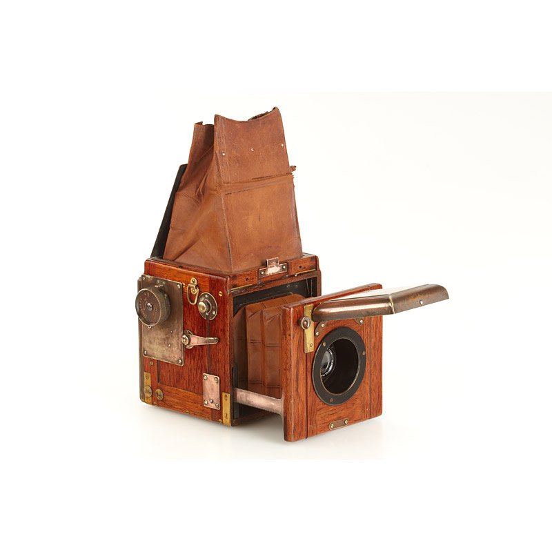 Houghton 'Ensign Special' Reflex -Tropical Model,: 6x9cm SLR, rare tropical model, teak body with brass fittings, brown leather bellows, with Tessar 4.5/12cm no.958035, focal plane shutter (not operable), in good original condition, one plate film hol
