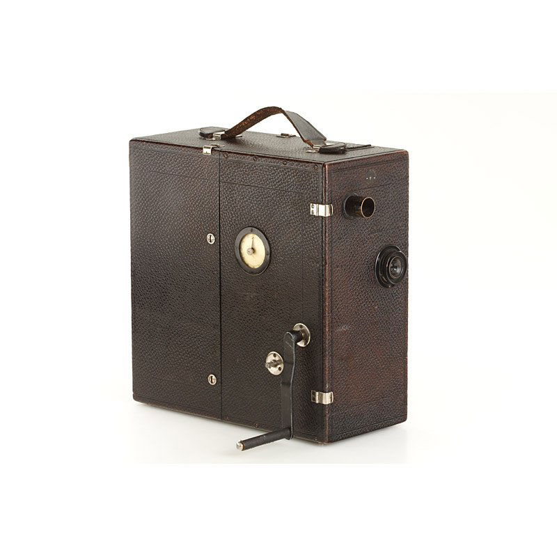 Ernemann Model A, SN: 179649, 1909: early hand cranked 35mm movie camera for 100 feet of 35mm film, leather covered wooden body with black brass fittings, both cassettes, Doppel-Anastigmat 5.4cm, rare camera in original condition
