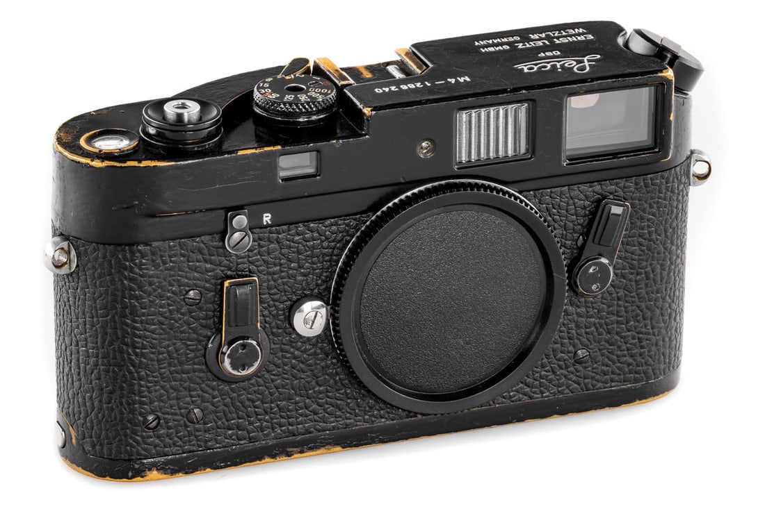 Leica M4 black paint: User black paint M4 in good working order, rangefinder patch showing some stain, but is still usable, some areas have been repainted such as the edges and the bottom plate, winding lever from an earli