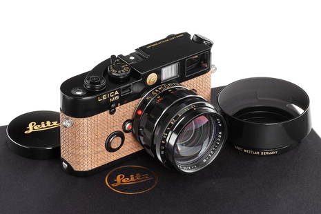 Leica M6 black paint 'Leitz Auction' outfit no.1/20 *: Leicacameras and lenses stand for outstanding, 'Made in Germany' quality. Thesehandcrafted, precision optical tools have had a major impact on the world ofphotography for more than 100 years.Every