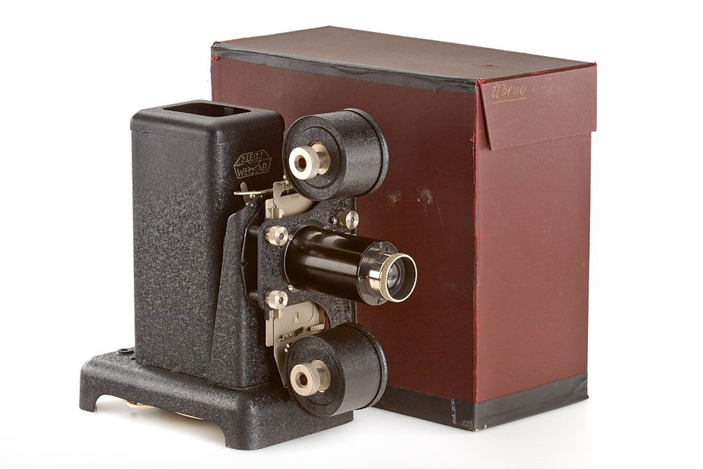 Leitz VIIIb / Ubeno, ser.no., 1931: early Leitz projector in very fine condition with two large film chambers, complete with matching Milar 4.5/8cm (cap and condenser) in early red maker's box marked 'Ubeno' on side