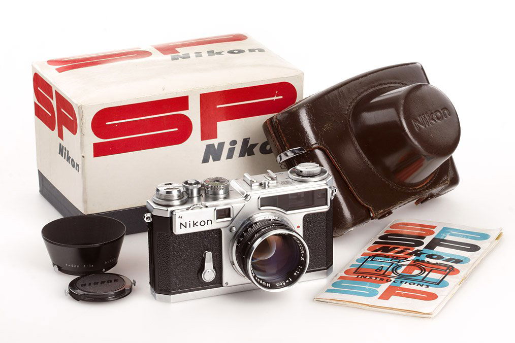 Nikon SP chrome, ser.no.6230562, 1963: mint SP with titanium shutter, motor-coupled base plate, Nikkor-S 1.4/5cm no.415155, black painted hood, cap, everready case, plastic bag, maker's box