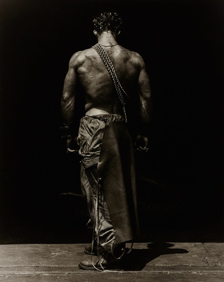 HERB RITTS (1952–2002) ‘Fred, Backview with Chain’ (Bod: Gelatin silver print 50,3 x 40,4 cm (19.8 x 15.9 in) Photographer's blind stamp in the margin, signed, titled and dated in pencil on the reverse, edition no. 16/25 LITERATURE Herb Ritts, Work, Boston 