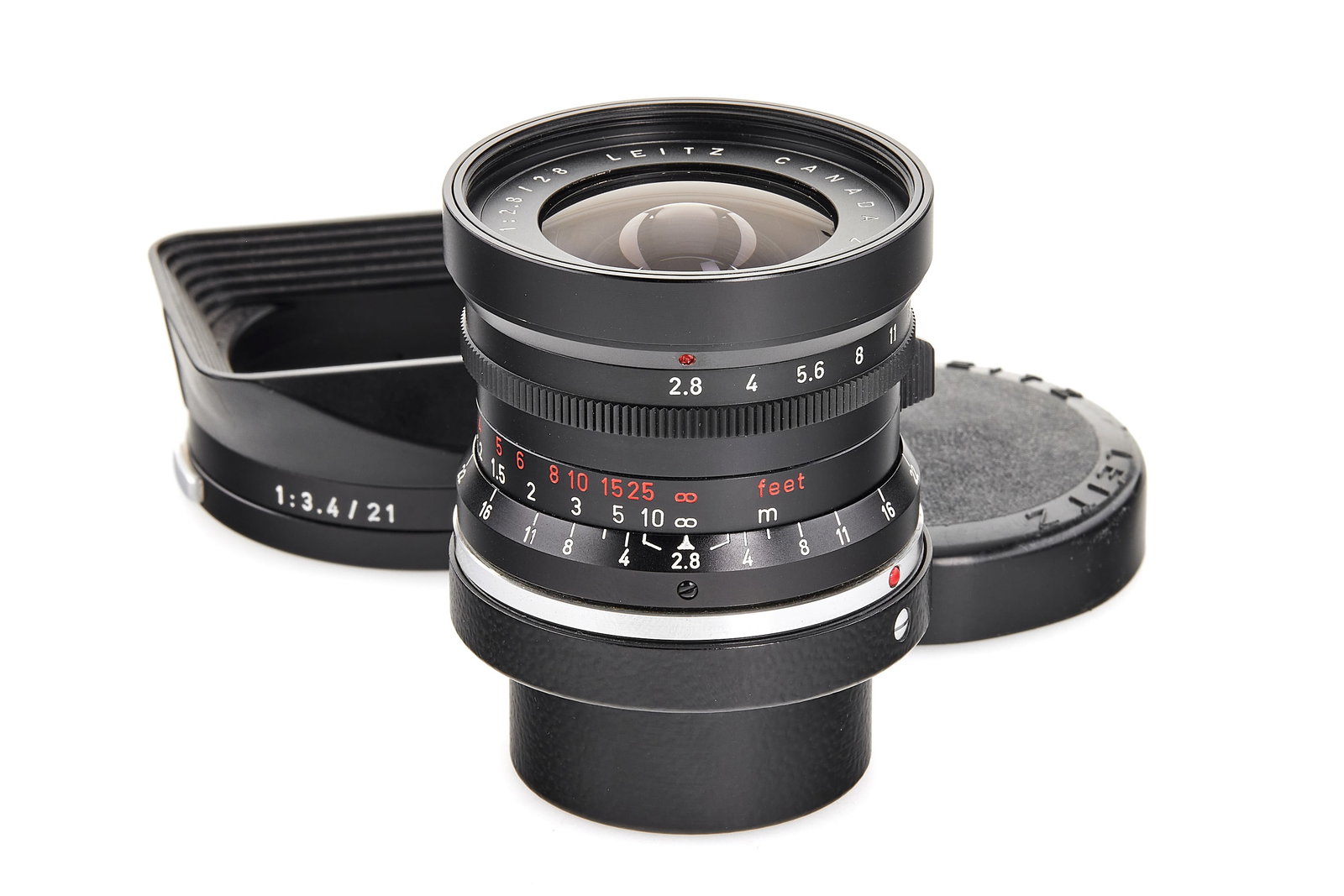 Elmarit 2.8/28mm 11801 9-element: Rare first type Elmarit 28mm with 9-element lens made in Canada, in beautiful, almost mint condition, with black painted infinity lock, good optics, with both caps, hood 12501 and matching maker's