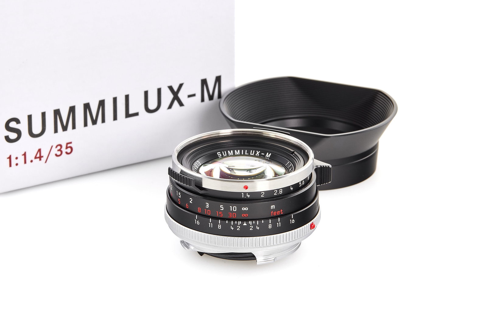 Summilux-M 1.4/35mm 11300 limited edition Black Steel Rim *: Beautiful re-issue of the sought-after 'Steel Rim' early Summilux 35mm from 1961, in black anodized finish and, like the original, silver stainless steel rim, black painted brass infinity lock button 
