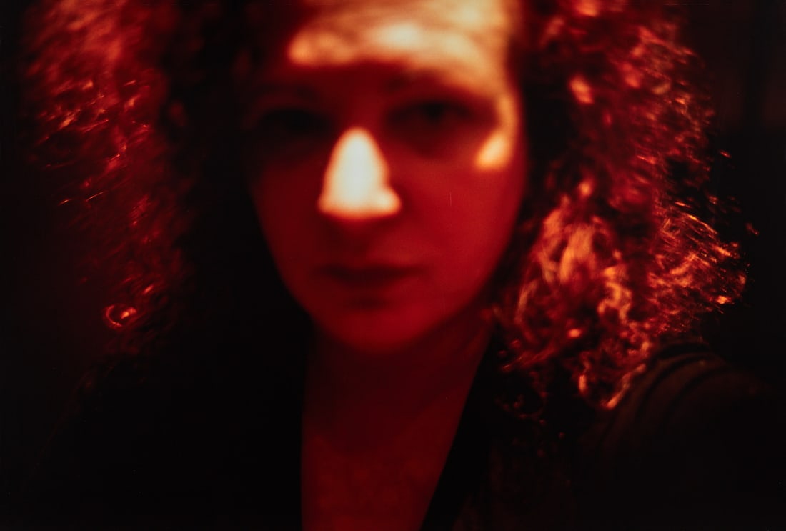 NAN GOLDIN (*1953) - Red self-portrait, Zurich 2000: Cibrachrome print, mounted on foam board 69,5 x 101,5 cm (27.4 x 40 in) Signed, titled, dated and numbered by the photographer in ink on the reverse, Edition # A.P. 1 PROVENANCE Private Collection, Zu