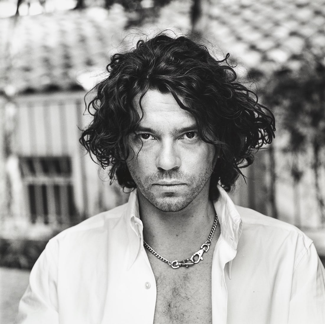 HELMUT NEWTON (1920–2004) - Michael Hutchence, 1993: Vintage silver print 25,4 x 25,4 cm (10 x 10 in) Signed by the photographer in pencil on the reverse LITERATURE Helmut Newton, Sex and Landscapes, Cologne, 2004, p. 56 (variant)