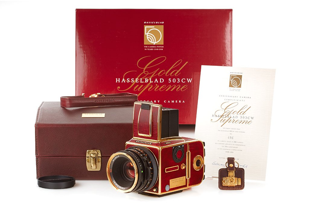 Hasselblad 503CW 'Gold Supreme': special edition for the 50th anniversary of Hasselblad, special number 496 of only 500 cameras produced, gold plated and claret-red leather, complete and new with lens, magazine, papers, all in maker'