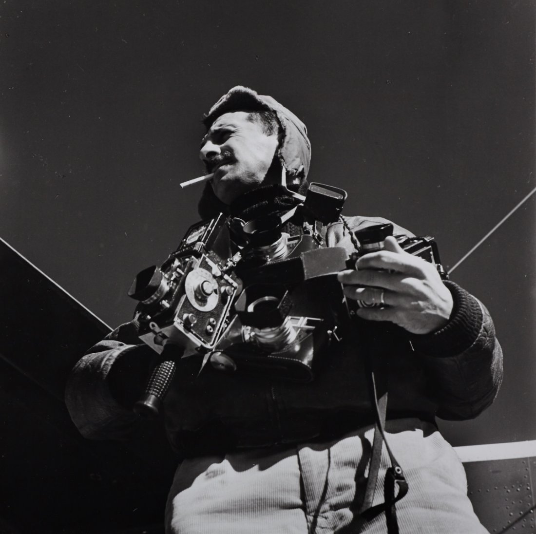 JEAN - PHILIPPE CHARBONNIER (1921 - 2004): W. Eugene Smith mit zwei Rolleiflex und zwei Leicas / with two Rolleiflex and two Leica cameras, 1960s, Vintage silver print 20 x 20,3 cm (7.9 x 8 in) Photographer's copyright stamp on the reverse, an