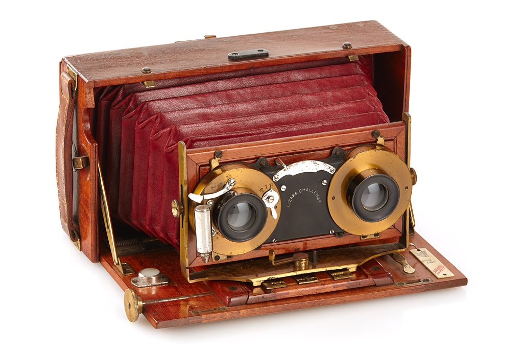 J. Lizars Challenge Tropical Stereo: 9x18cm, polished wooden body with red leather bellows, a pair of Bausch & Lomb lenses in brass stereo shutter, original focusing screen back with protecting cover, a very rare camera, c.1910