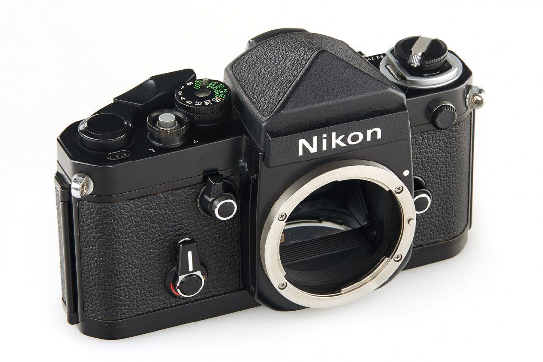 Nikon F2 black *: black painted body in almost mint condition with DE-1 titanium prism finder, c.1980, no. 7954641 The buyers premium for all items exported out of E.C. (European Community) is 23%. For items marked wit