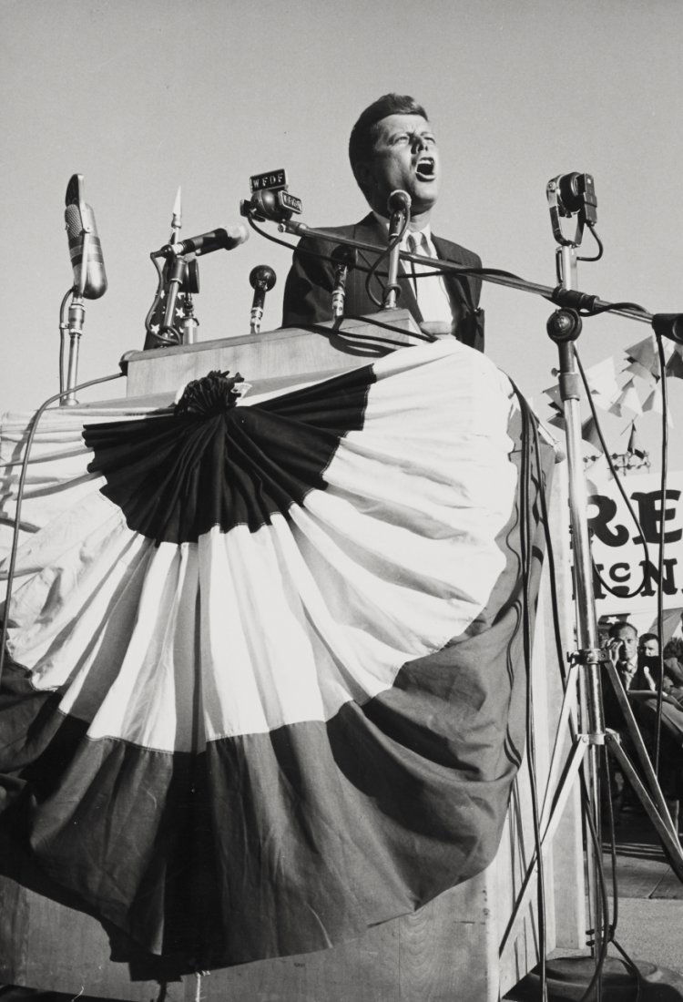 CORNELL CAPA (1918–2008): John F. Kennedy1960, Vintage silver print 25,2 x 17,2 cm Photographer's agency copyright stamp, neg. no. “60 14 2 16” stamp and several handwritten numerical notations in ink on the reverse JFK al
