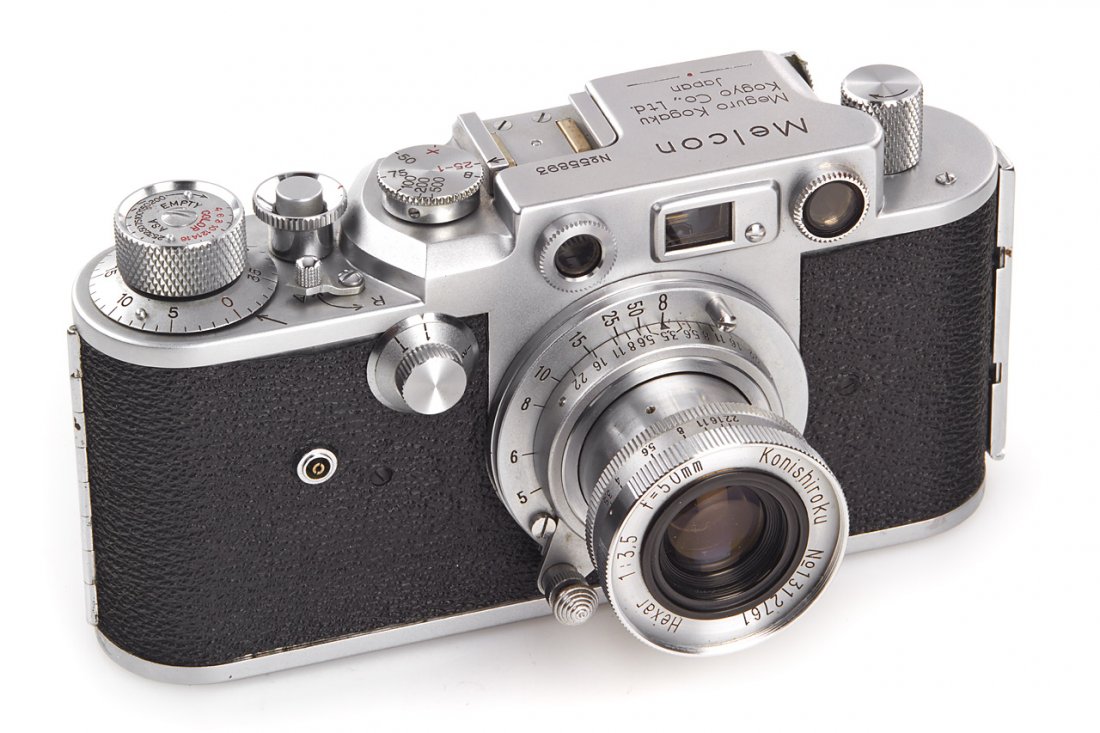 Meguro Kogaku Melcon (Original): rare copy of the Leica III with hinged back in very nice condition and perfect technical order, matching Hexar 3.5/50mm no.1312761(clean lenses), 1955, no. 55893 The buyers premium for all items expor