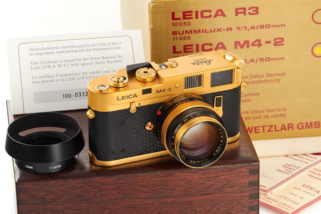 Leica M4-2 Gold 'Oskar Barnack' *, 1979, no. 1527223: limited gold plated edition for the 100th anniversary of the birth of the Oscar Barnack, special edition number 100-0313, in near mint condition and perfect working order, with gold-plated Summilux 1.
