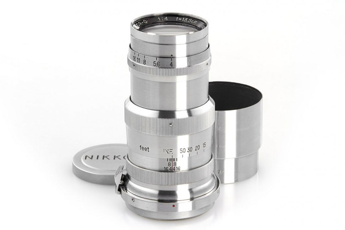 Nikon 4/13.5cm Nikkor-Q.C, 1950, no. 524022: rare and early Tokyo lens in top condition, engraved 'MADE IN OCCUPIED JAPAN' on RF cam, with chrome rear cap, chrome hood and 'NIKKOR' front cap, Tokyo leather case - less than 300 lenses of this Typ