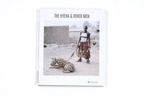 PIETER HUGO (* 1976): ‘The Hyena And Other Men’, Prestel Verlag, Munich 2007 * First edition, first printing, signed by Pieter Hugo, hardcover with full brown cloth and dust jacket, 80 pages, 33 colour photographs, 28,