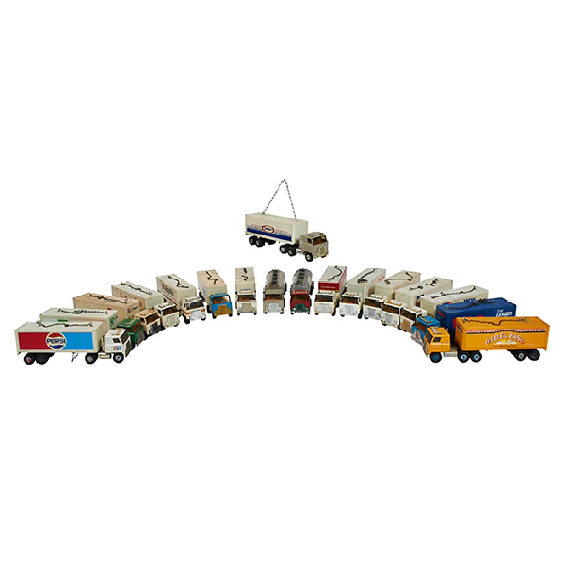 Ertl, A group lot of seventeen (17) advertising semi: Ertl, A group lot of seventeen (17) advertising semi trucks with trailers, including:, All Star Dairies, Spector, Marriott, Zenith, Kraft, Amway, Cameo Container Corporation, Coils Inc., RCA, La Preff