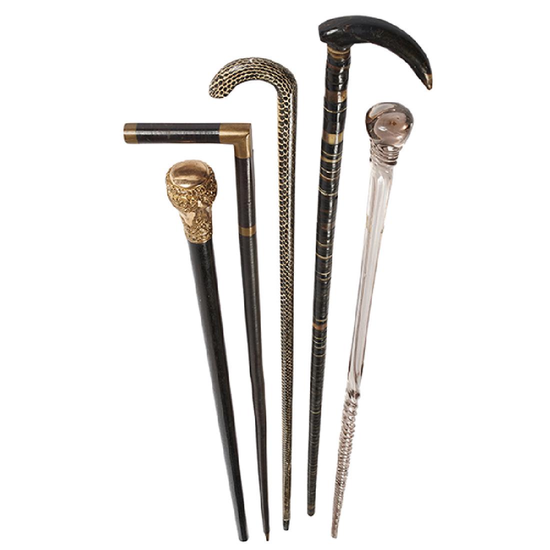 Group Lot, five (5) canes: 1) gilt metal, ebonized (1 of 2)