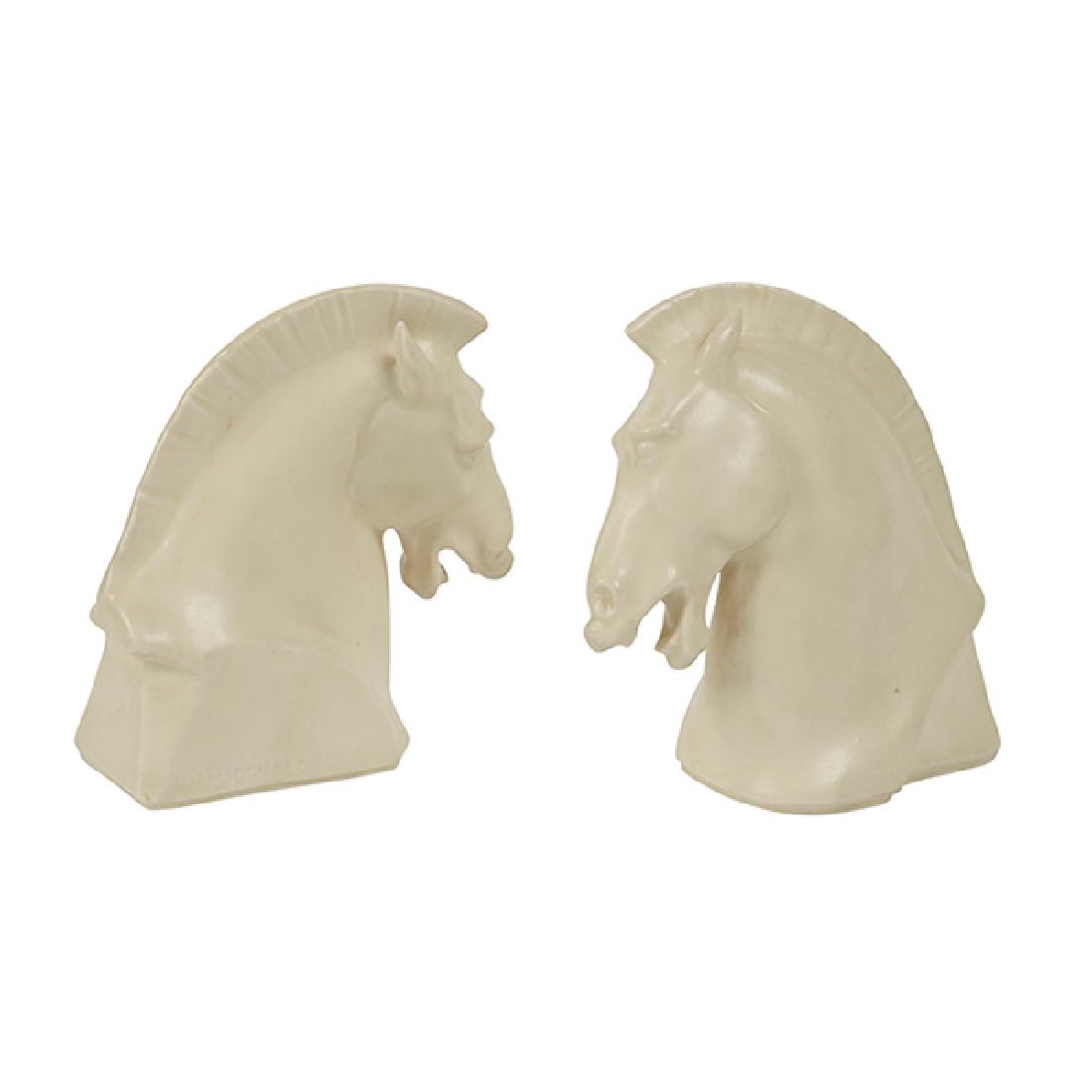 William P. McDonald (1864-1931) for Rookwood Pottery,: William P. McDonald (1864-1931) for Rookwood Pottery, Horse Head bookends, #6014, Cincinnati, OH, 1934, white matte glazed ceramic, impressed marks, dated, numbered, 5.75"w x 3"d x 6"h Provenance: Pro