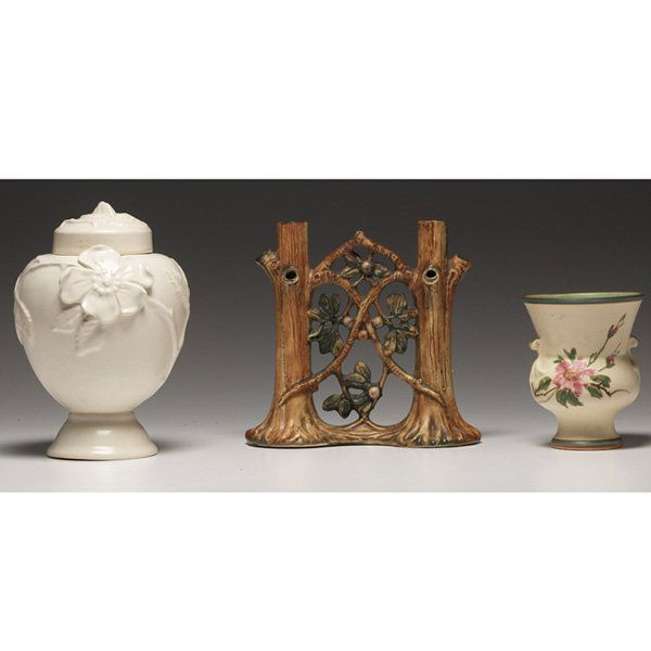Weller covered vessel with a Weller Bonito: Weller covered vessel, flower and leaves in high relief covered with a white matt glaze, marked, 5.5"w x 8.25"h; with a Weller Woodcraft double bud vase, tree trunks and fruit, marked, 8"w x 7.5"h, ch