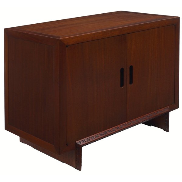 Frank Lloyd Wright cabinet: Frank Lloyd Wright cabinet, manufactured by Heritage Henredon, paneled top over two cabinet doors with recessed handles, base with Taliesin design to edge, signed with script signature, original finis