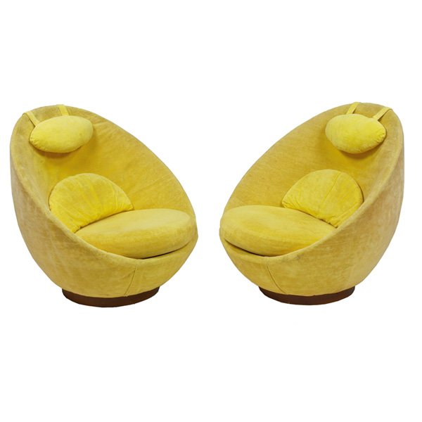 Selig lounge chairs, pair: Selig lounge chairs, pair, by Selig Imperial, 1960s, egg-shaped forms on rocking swivel bases, removable lumbar cushion, seat cushion, and weighted head cushion, original yellow velour upholstery, sig