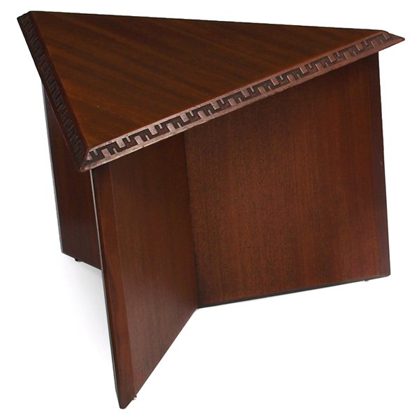 Frank Lloyd Wright table: Frank Lloyd Wright table, manufactured by Heritage Henredon, triangular form with Taliesin design to edges, original finish, signed with red monogram, minor chipping to edge, 22"w x 19.5"d x 15"h, ver