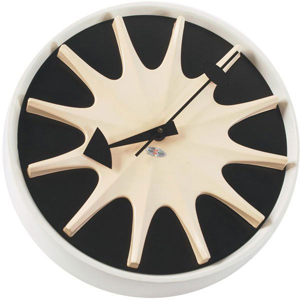 George Nelson & Associates wall clock, model 2271: George Nelson & Associates wall clock, model 2271, by Howard Miller, off-white starburst on a black face, white metal case, signed with foil label, original finish, 13"dia., excellent condition
