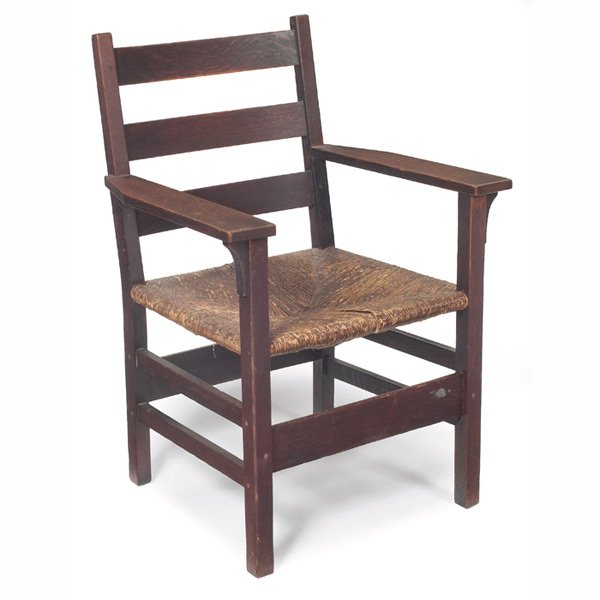 Gustav Stickley armchair, #310: Gustav Stickley armchair, #310, worn original rush seat, corbel supports under each arm, recoated original finish, remnant of red decal, 25"w x 23"d x 36"h, very good condition