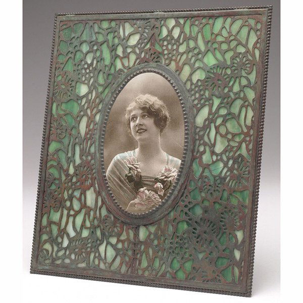 Riviere Studios frame, large form in bronzed metal: Riviere Studios frame, large form in bronzed metal with an organic design over green and white glass, unmarked, 9"w x 10.5"h, minor cracks to glass