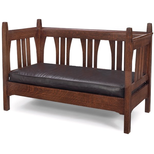 Arts & Crafts settee, in the style of Gustav Stick: Arts & Crafts settee, contemporary, in the style of Gustav Stickley, tapered posts with curved vertical slats at back and sides, notched rail, recovered seat cushion, original finish 60"w x 28"d x 40"