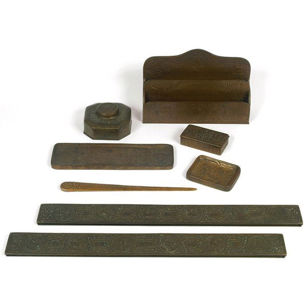 Tiffany Studios desk set, Zodiac pattern: Tiffany Studios desk set, bronze in the Zodiac pattern, includes blotter ends, #988, 19.25" x 2", tray, #1000, 10" x 3", letter opener, #1095, 10.75", tray, #976, 4" x 3", inkwell, #842, 4.5" x 4.5" x