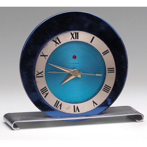 Art Deco clock, chromed-metal with a blue glass: Art Deco clock, chromed-metal with a blue glass circular face and a brass plate with Roman numerals, marked Telechron, 7.5"w x 6.5"h