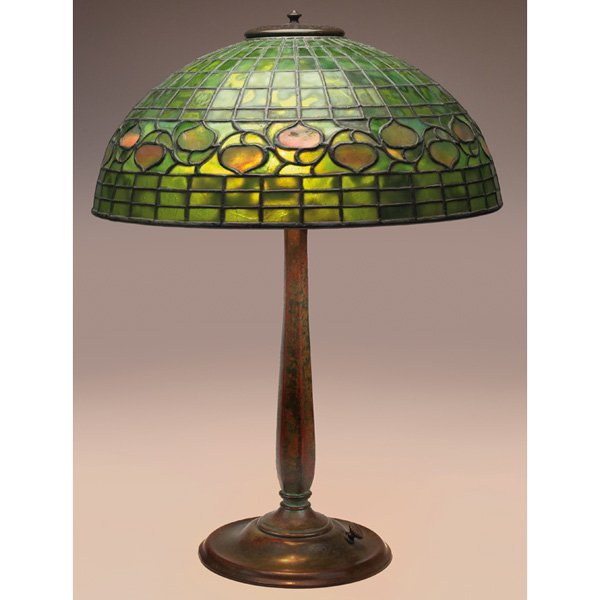 Tiffany Studios lamp, bronze stick base: Tiffany Studios lamp, bronze stick base, supporting a green leaded glass shade with a leaf and vine pattern, base signed Tiffany Studios New York #534, shade signed Tiffany Studios New York, original 