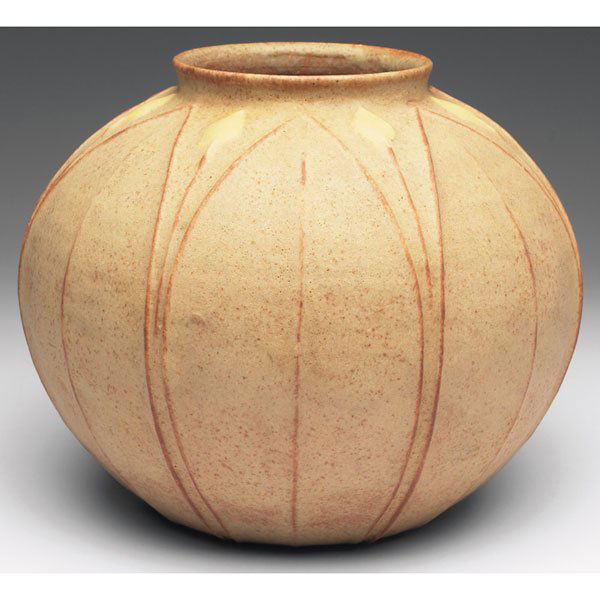 The Arts & Clay Company jardiniere: The Arts & Clay Company jardiniere, contemporary, broad vertical leaves and buds covered in a mottled yellow and brown glaze, #2A, marked, paper label, 10"w x 8"h