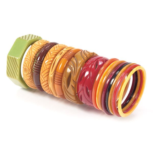 Bakelite bracelets 16 green, yellow, red, orange: Bakelite bracelets, 16, green, yellow, red, butterscotch and orange, 3 with pierced decoration, average size is 3"dia, tight hairline to large cherry red bracelet, otherwise very good original conditi