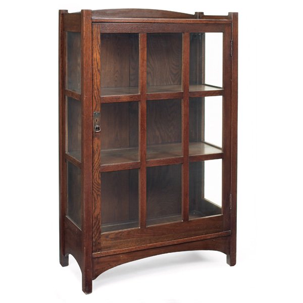 Nice L & JG Stickley china cabinet, #727 : Nice L and JG Stickley china cabinet, #727, single door with nine panes of glass and three at each side, arched rails, has retailer's paper label, original finish, 34"w x 15"d x 54.5"h, very good cond