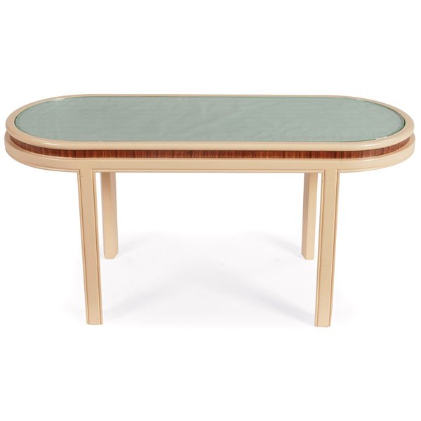 Eugene Schoen occasional or coffee table: Eugene Schoen occasional or coffee table, by Schmeig & Kotzian, 1930s, oval top with recessed horizontal band of exotic wood, off-white lacquered finish, inset glass top over a silk fabric panel, impr