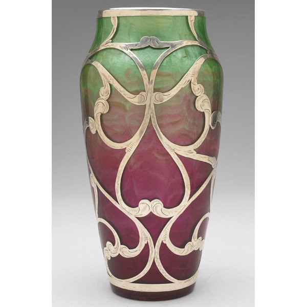 Loetz Titania vase: Loetz Titania vase, large tapered shape in green and red glass with an applied silver overlay, unsigned, 4.5"w x 9"h, a few of areas of repair to silver