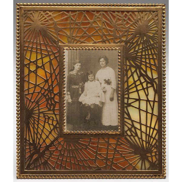 Tiffany Studios frame, bronze in the Pine Needle p: Tiffany Studios frame, bronze in the Pine Needle pattern over caramel and white glass, rectangular window and beaded edge, original gold dore patina, signed Tiffany Studios, New York, #948, 6.5"w x 7.