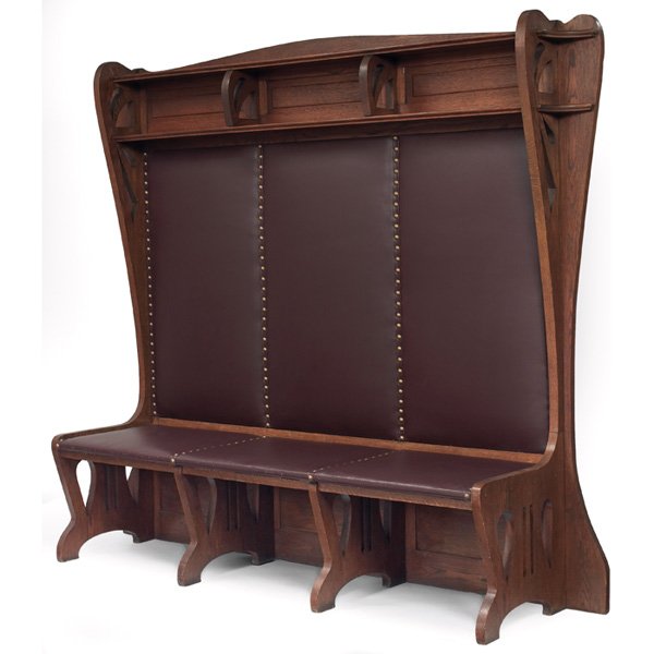 Arts and Crafts: Arts and Crafts hall bench, massive form with pierced design anddivided compartments at back over a recovered leather seat and back,original finish, 88.5"w x 20"d x 76"h, very good condition