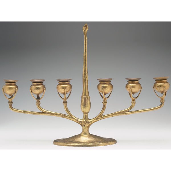 Tiffany Studios: Tiffany Studios candelabra, six light form in bronze with center post bearing a fitted candle snuff and extending arms supporting six pod-form candle holders with removable bobeches, original gold dor
