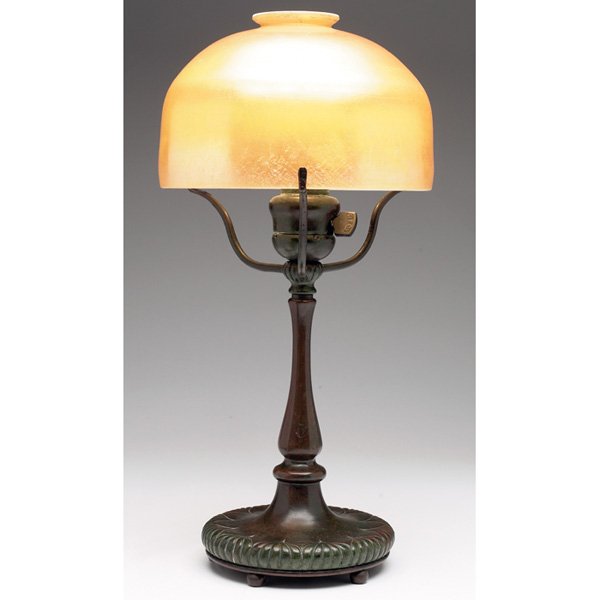 Tiffany Studios: Tiffany Studios lamp, bronze three-arm base with original patina, holding a gold favrile glass shade, base signed Tiffany Studios, New York, #322, shade signed L.C.T. Favrile, overall: 7"w x 15"h